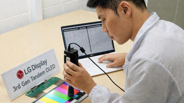 An LG Display employee testing OLEDs